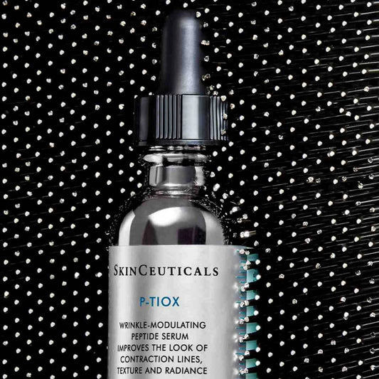SkinCeuticals P-TiOX serum bottle with black background